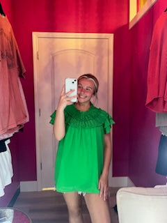 green ruffle neck blouse