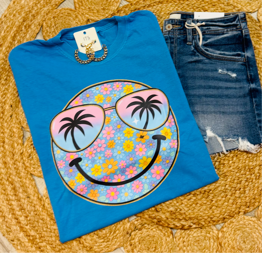 Blue floral smiley face with glasses tee