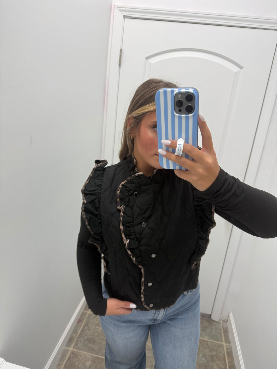 Black vest with cheetah lining