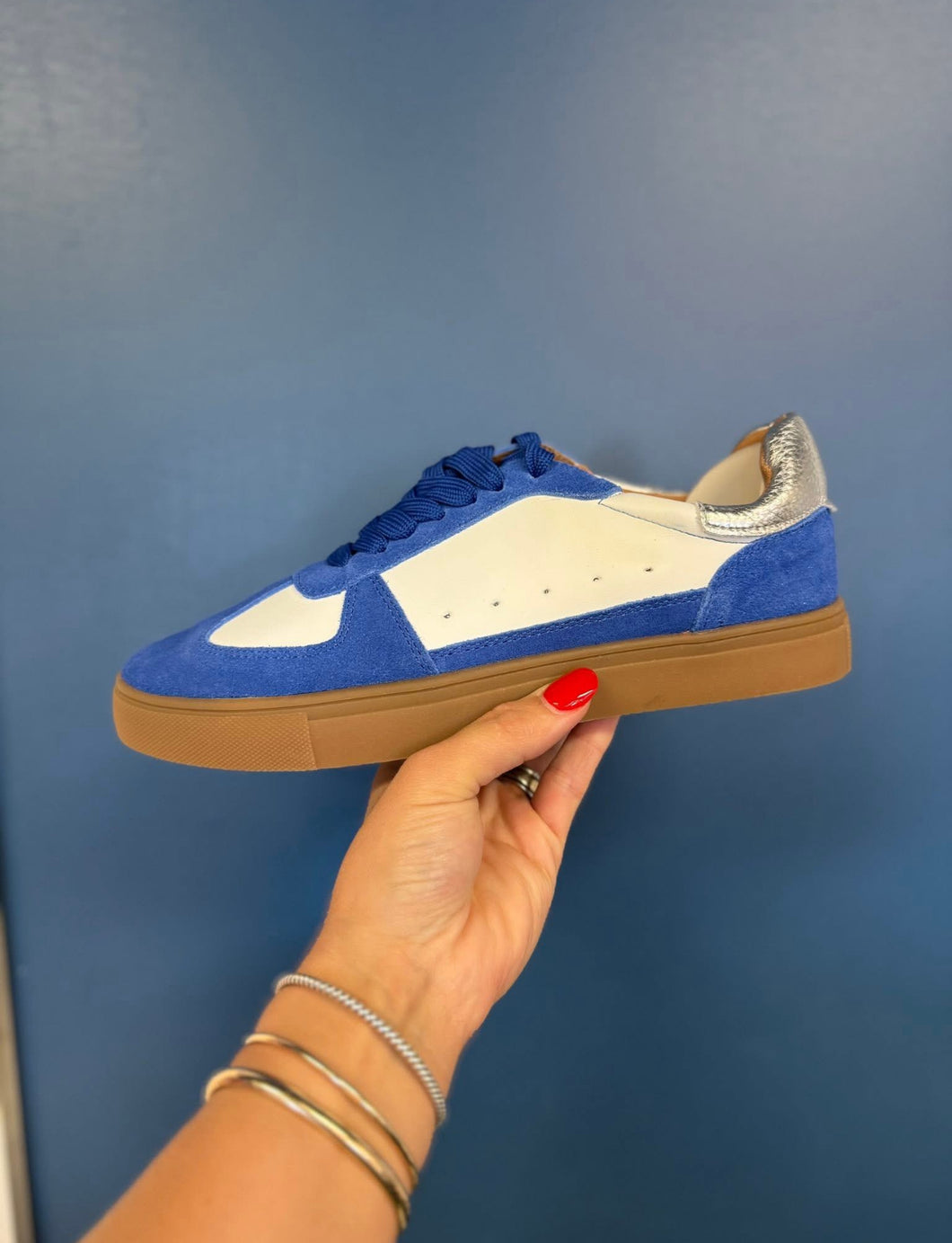 Blue and silver tennis shoes