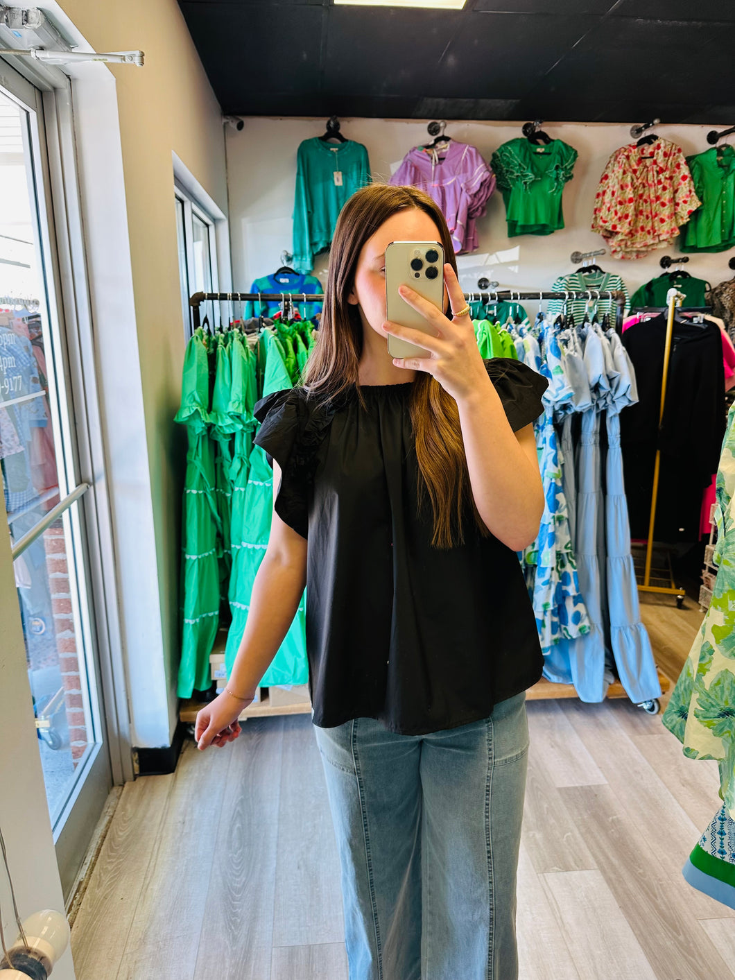 Black ruffled blouse