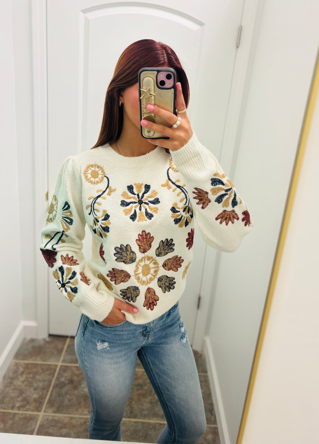 white sweater with floral print