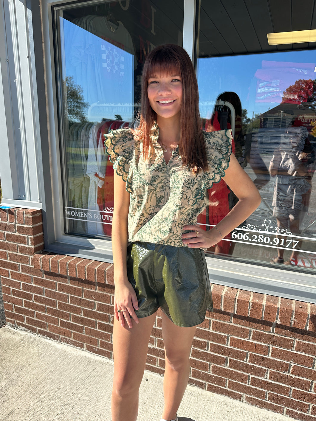 Green and tan floral top with scallop sleeves