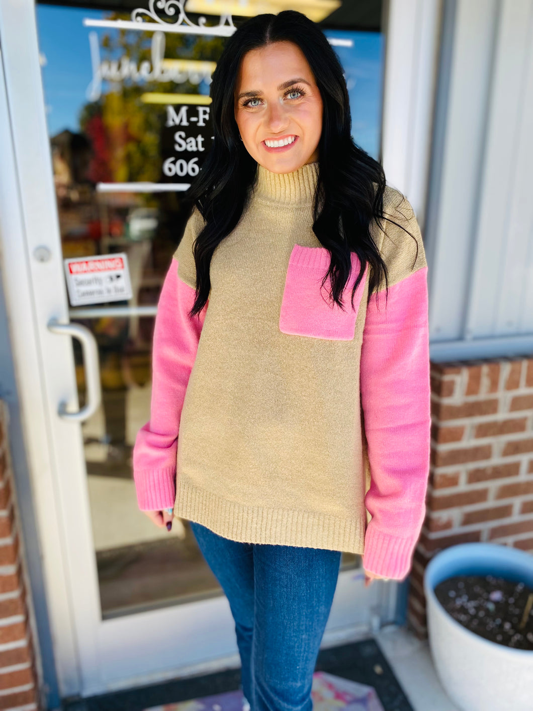 pink and tan sweater